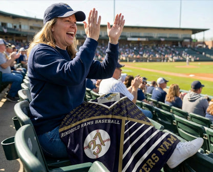 Person at a baseball game with a Ringgold Rams Baseball blanket draped over their lap