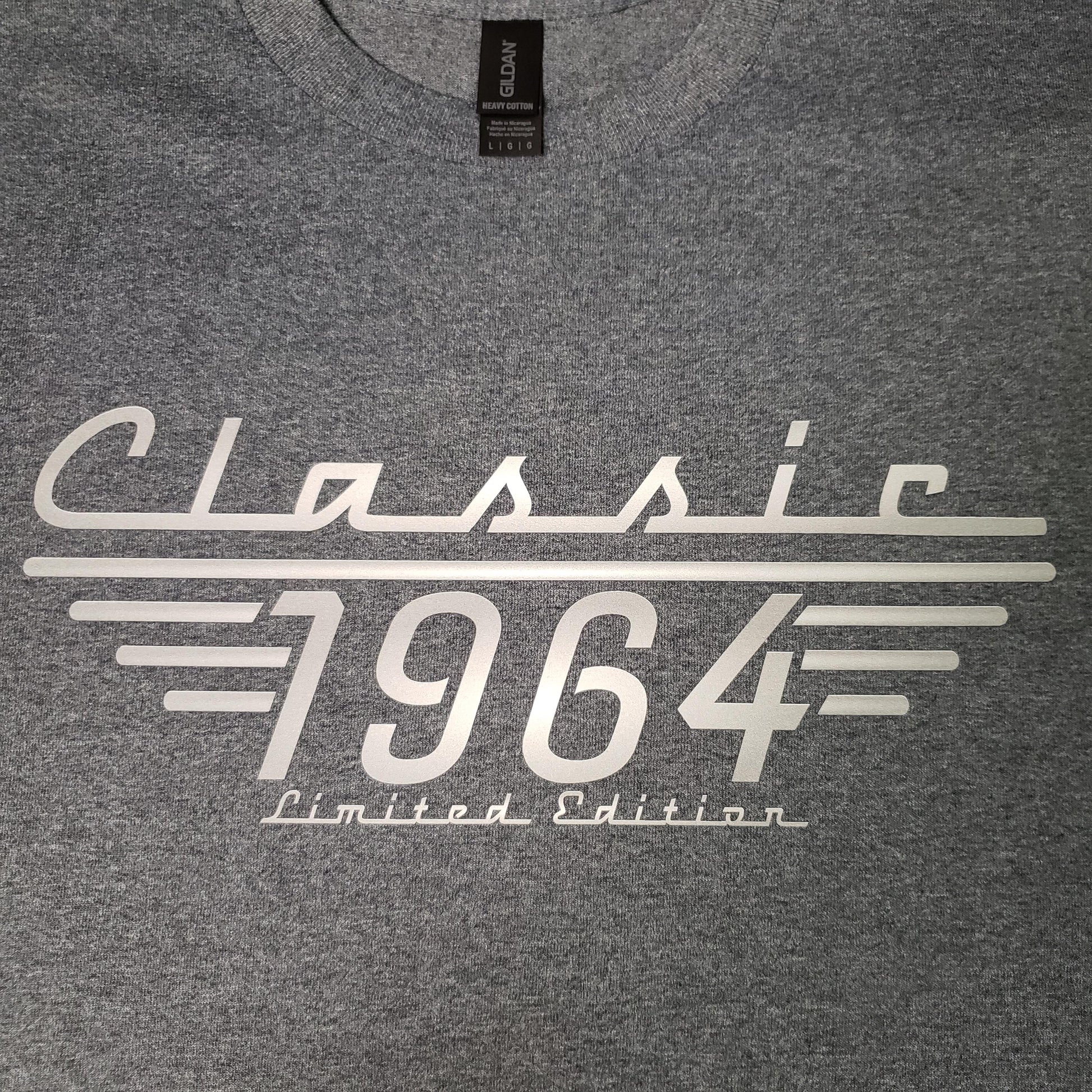 A gray t-shirt with the text 'Classic 1964 Limited Edition' printed in shades of grey and white on the front.
