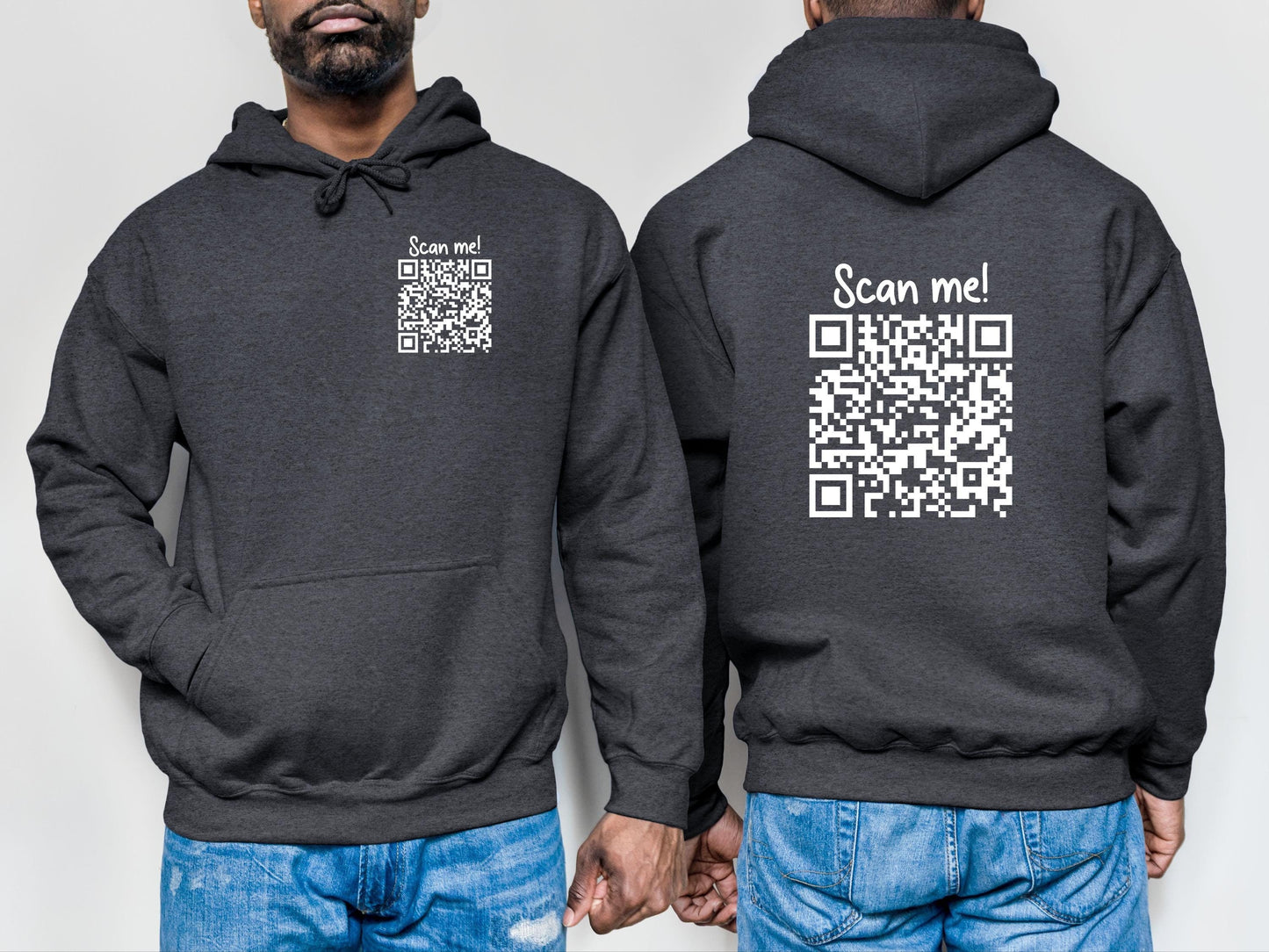 Man wearing a black hoodie with scan me and a qr code printed in white on the left chest and the back which when scanned leads to a webpage that says either fuck you or fuck off.