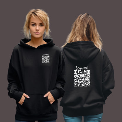 Woman wearing a black hoodie with scan me and a qr code printed in white on the left chest and the back which when scanned leads to a webpage that says either fuck you or fuck off.