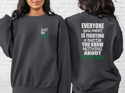 dark heather gray crewneck sweatshirt showcasing a minimalist &quot;Just Be Kind&quot; message with bold text on the back