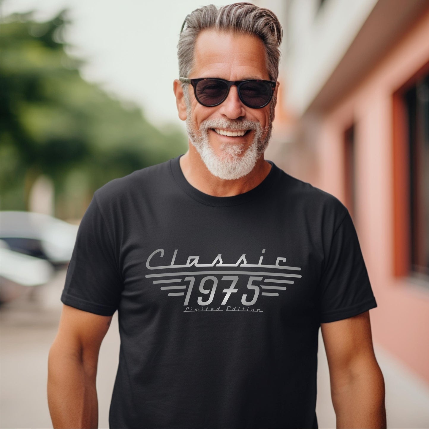 Man wearing a black t shirt with Classic 1975, Limited Edition printed in greys.  50th Birthday Shirt for men