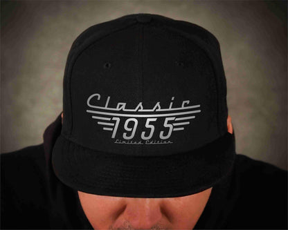 Man wearing a black baseball cap with the phrase Classic 1955, Limited Edition for a 70th Birthday gift.
