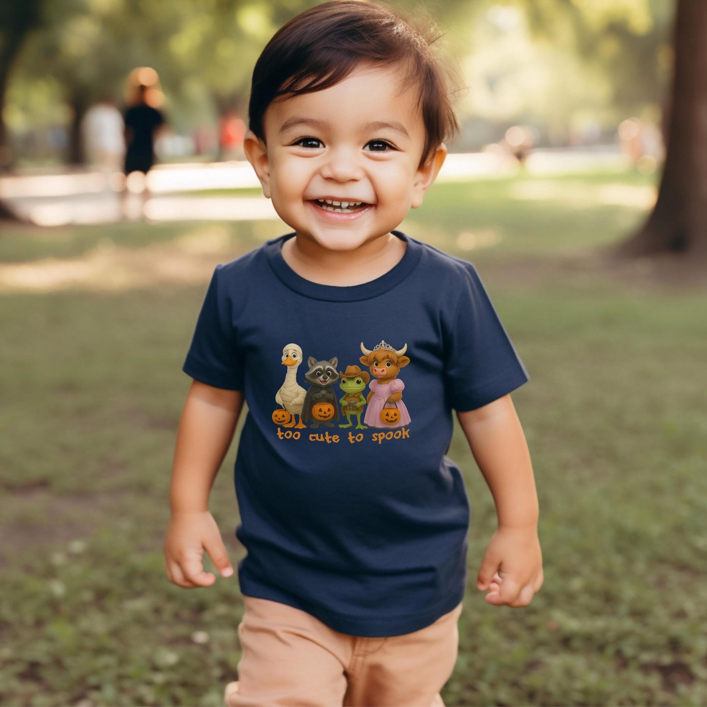Navy toddler Halloween shirt with animal characters and &quot;Too Cute to Spook&quot; design.