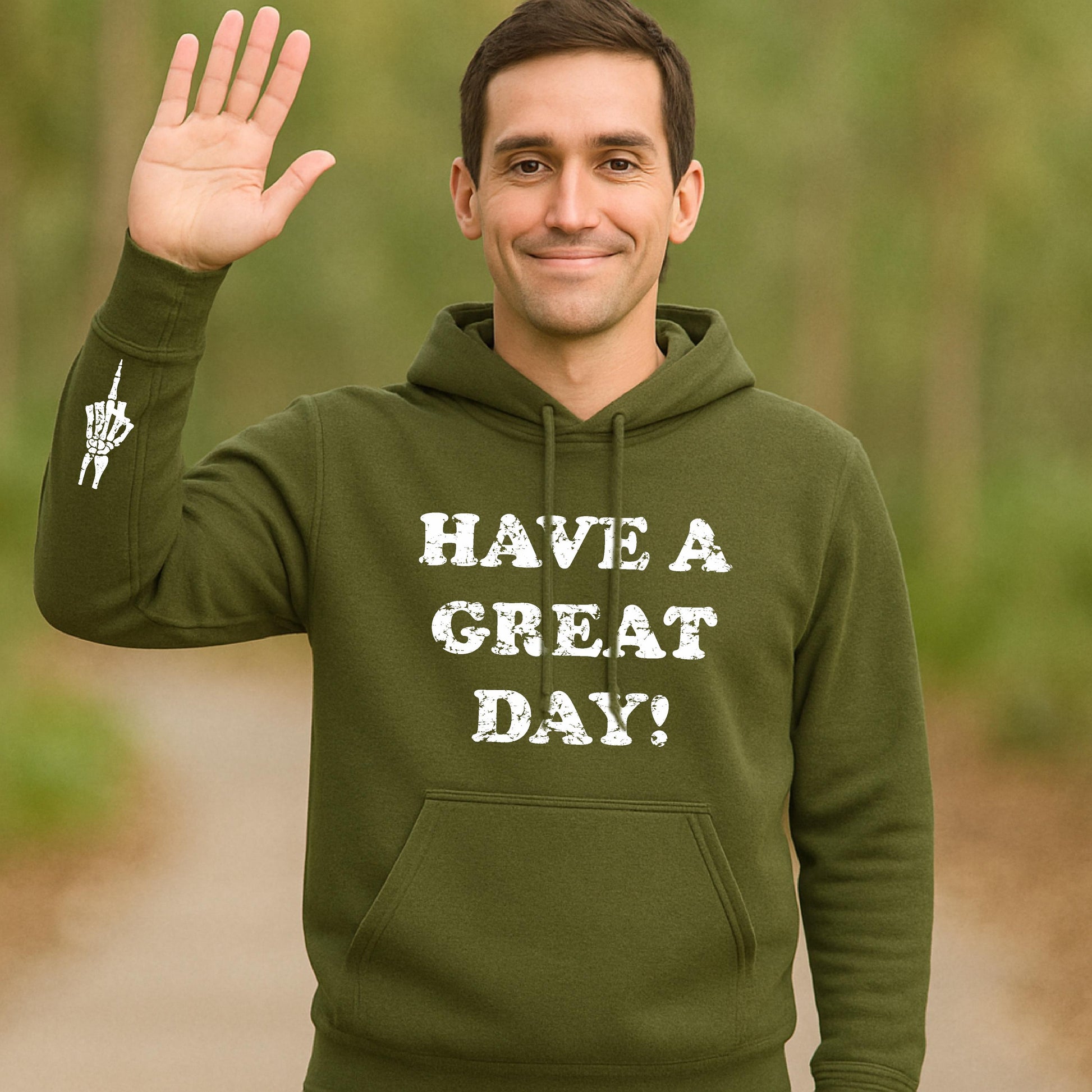 Man wearing olive green hoodie with “Have a Great Day!” text and skeleton middle finger on sleeve