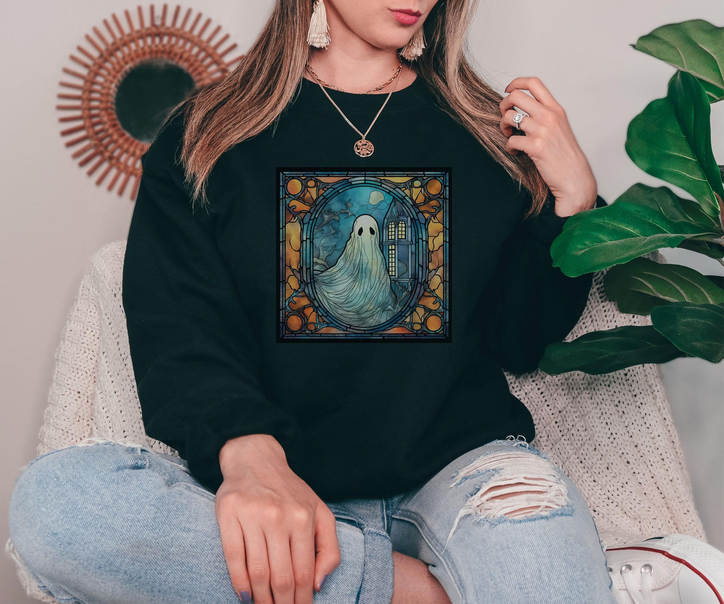 Black sweatshirt with stained glass ghost and haunted house print, fall fashion Halloween design