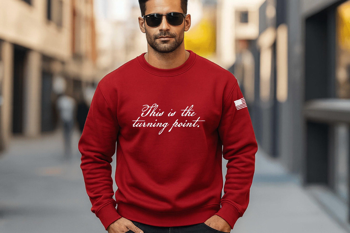This is our turning point printed on a red crewneck sweatshirt with a distressed American Flag printed on the sleeve.