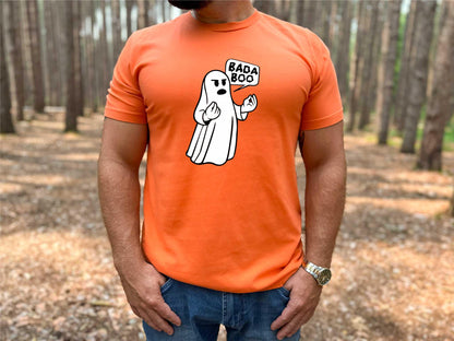 Man wearing orange Bada Boo Italian ghost shirt in fall forest setting.
