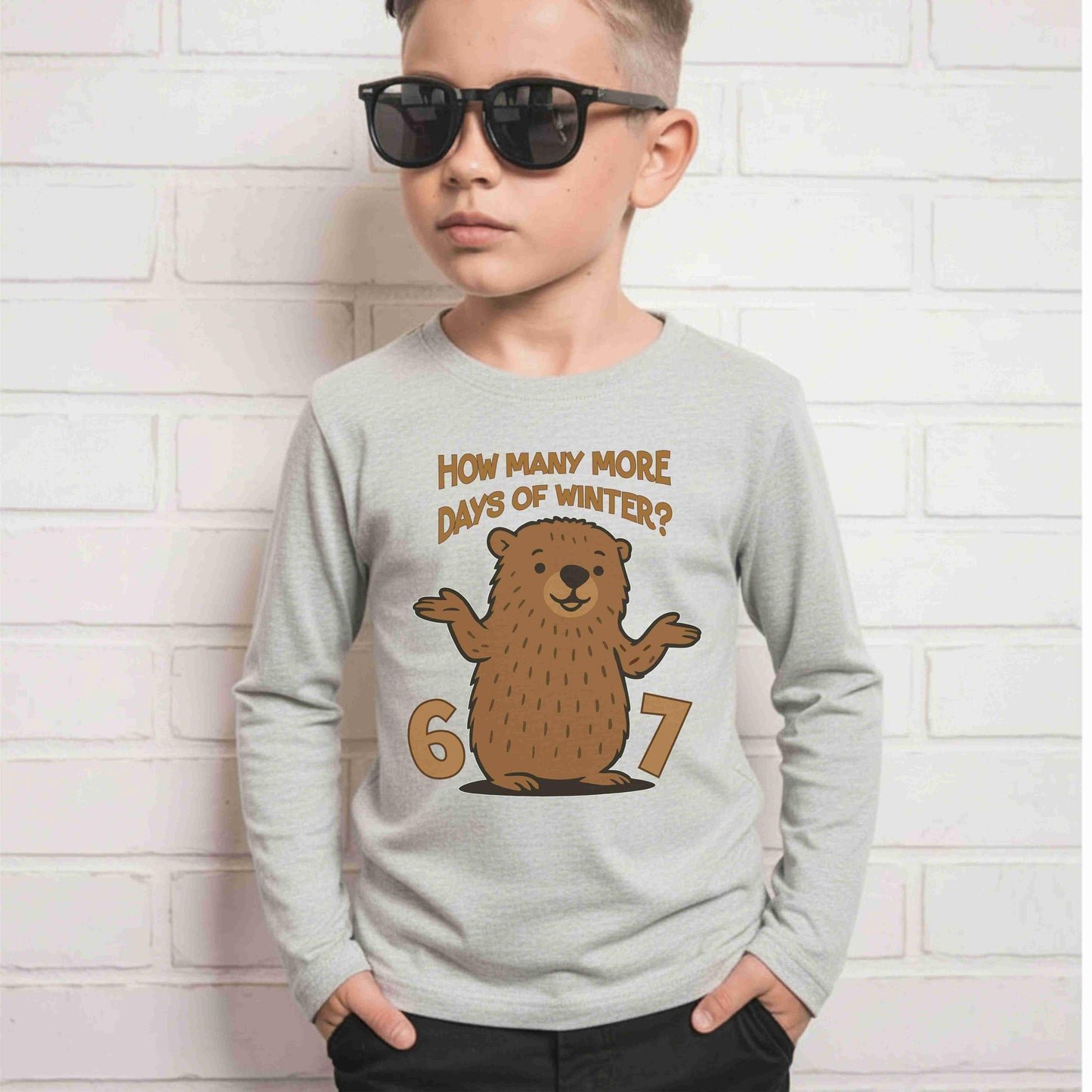 Kid in light grey long sleeve with funny groundhog 6 7 how many more days of winter graphic