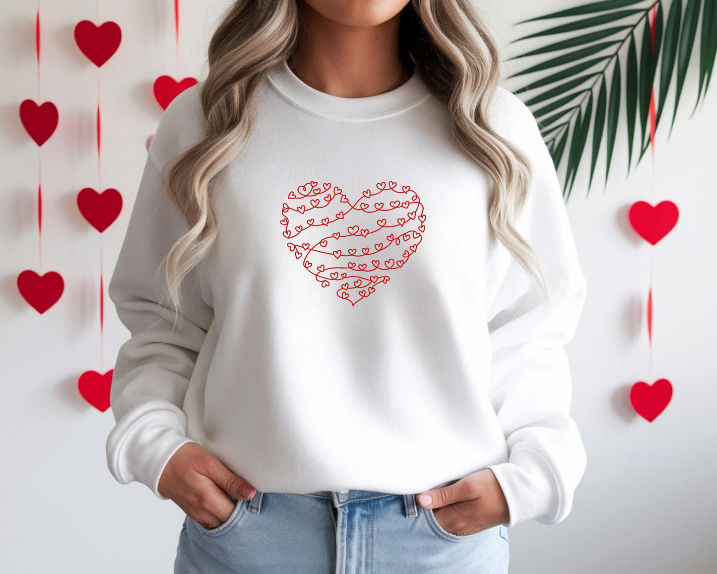 Woman wearing white minimalist heart line Valentine’s Day sweatshirt with continuous line heart design