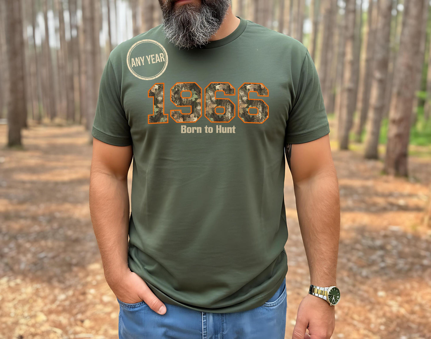 Man with grey beard wearing a 1966 Born to Hunt t-shirt with orange-outlined camouflage numbers in a pine forest. Perfect for the hunter who is turning 60 year old.