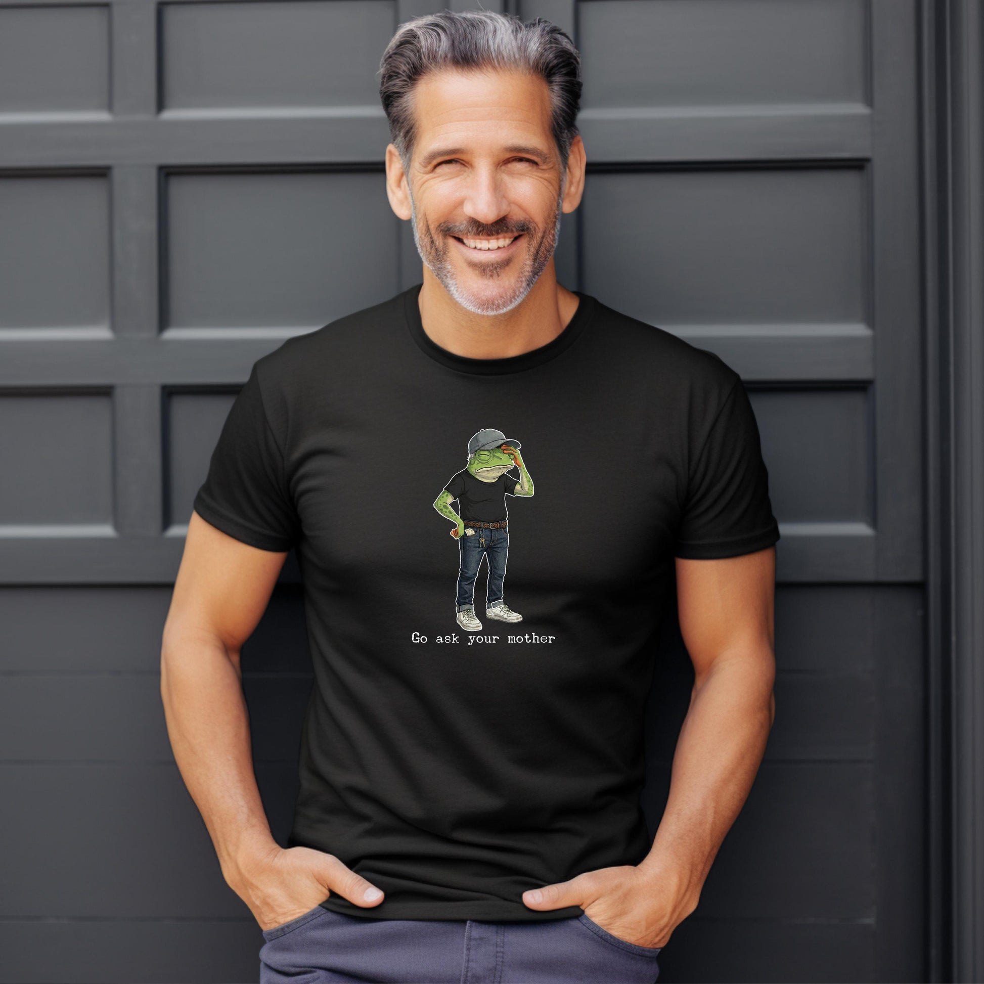 Black t-shirt with a cartoon frog wearing a cap and jeans, with text reading Go ask your mother.
