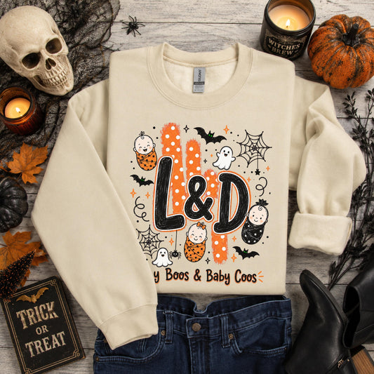Sand-colored Gildan sweatshirt with L&D Halloween design: babies, ghosts, bats, "Tiny Boos & Baby Coos" text
